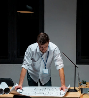 Architect reviewing building plans – Architect Pro Dallas